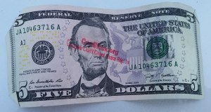 Dollars are generally not the preferred currency, but here's a photo of the kind of dollars you'd see around Porcfest.